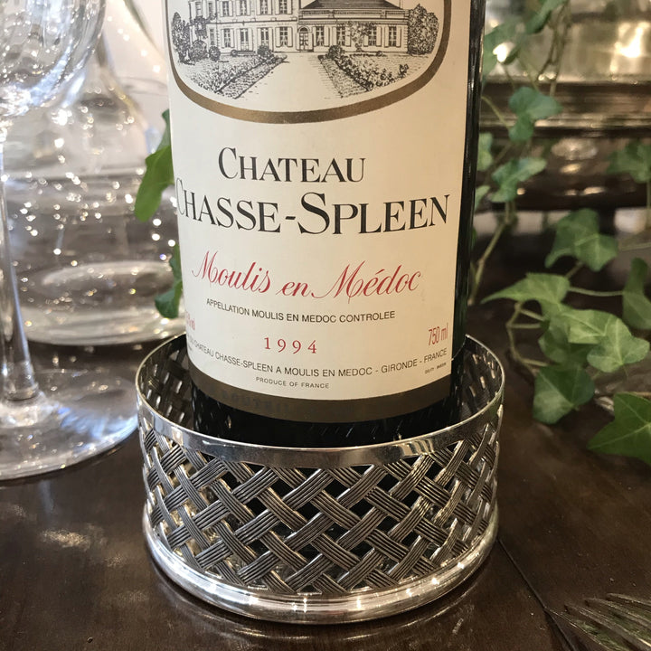 Dessous de bouteille en métal argenté tressé